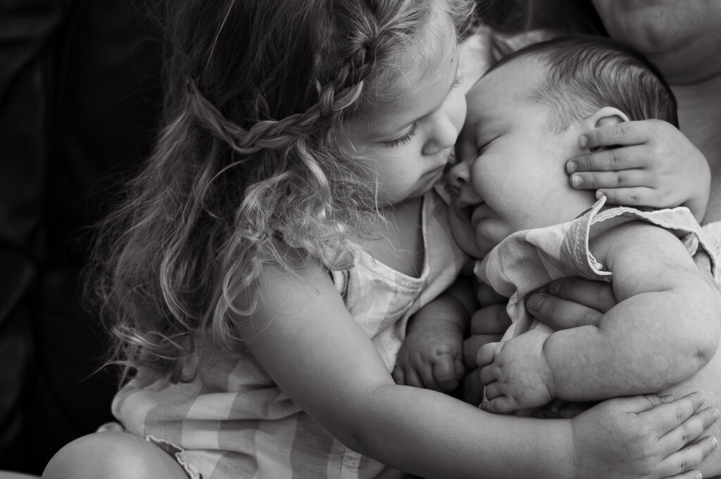 Chicago newborn session with brother and sister hugging