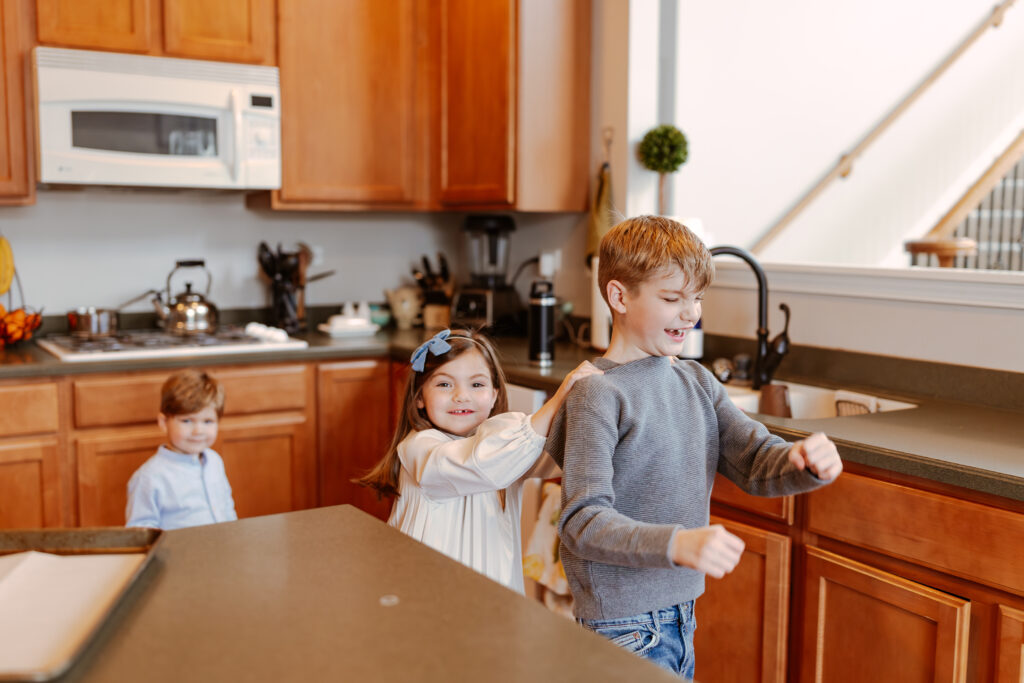 In home documentary session playing in kitchen