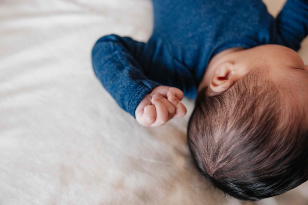 Baby hair and hand details in Elmhurst, IL by Taylor Lynn Studios