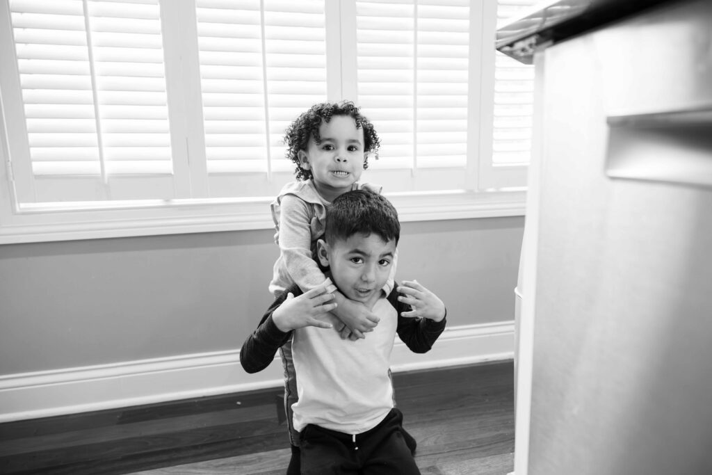 Siblings play fighting in elmhurst IL by Taylor LYnn Studios