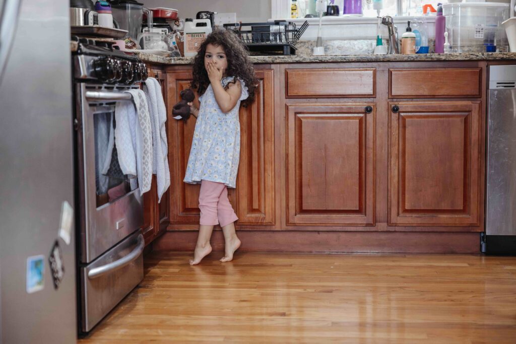 Toddler in kitchen family session