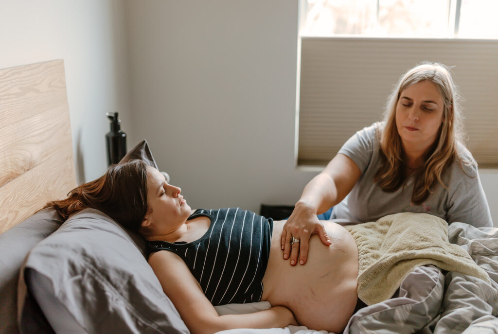 New mom at postpartum newborn session in chicago il