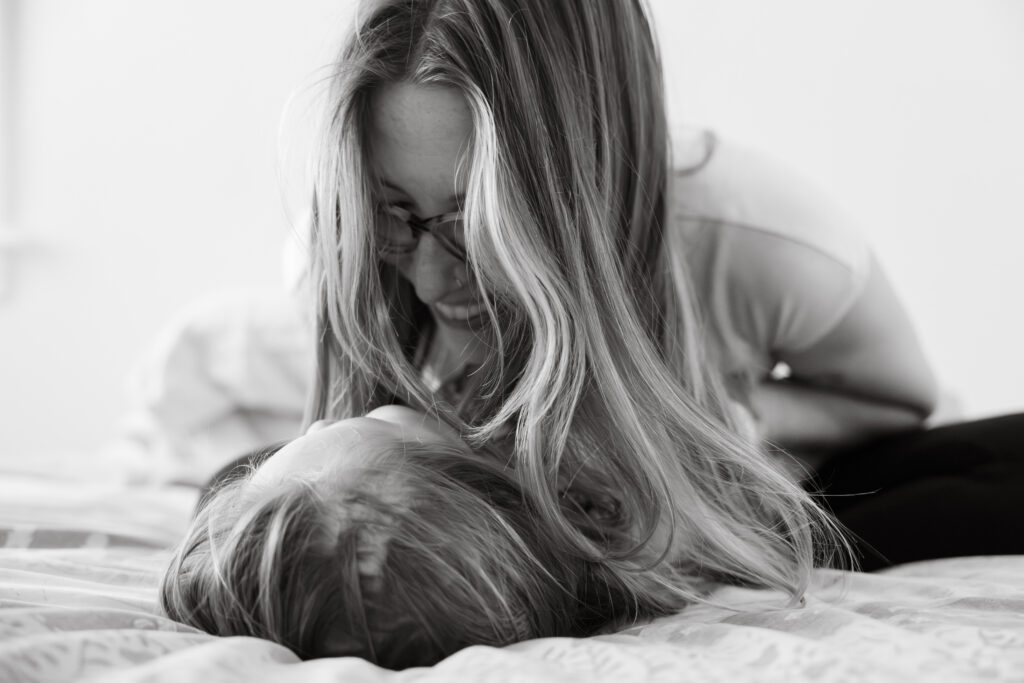 Mom cuddling 3 year old son during family session in chicago, IL