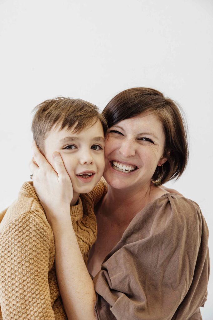 Mom and older son photo in white studio in chicago il by Taylor Lynn Studios