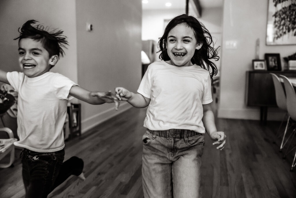 Brother and sister running during family photography session in chicago