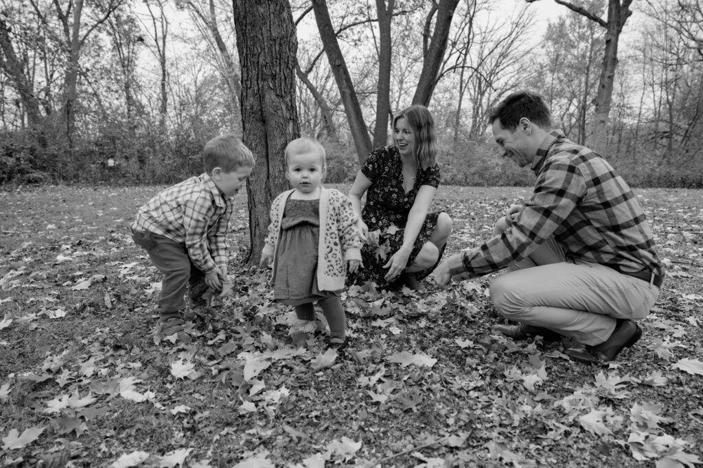 Family throwing leaves at Fall Family session in Wheaton, IL